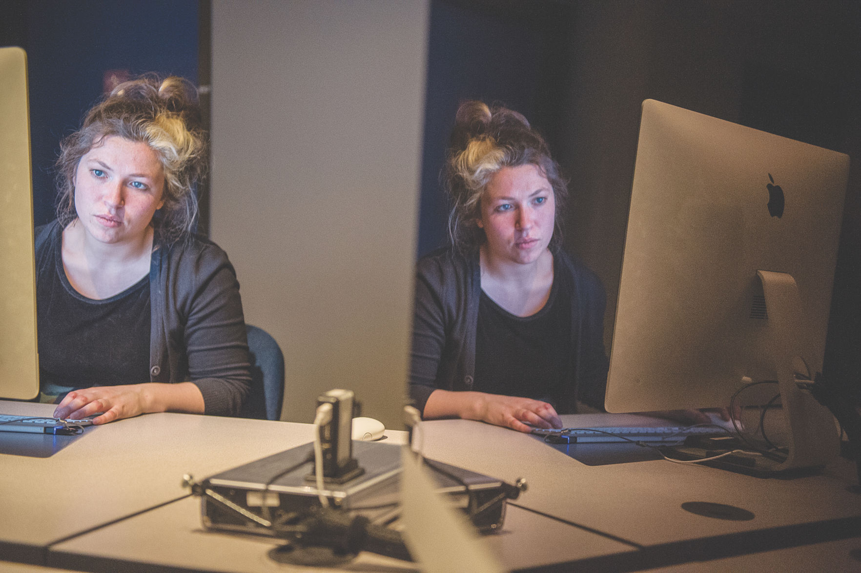 Photography student Clara DeWeese edits photos in one of the campus editing labs